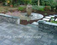 Patio with seating wall and water feature