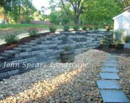 Patio with seating wall and water feature 1